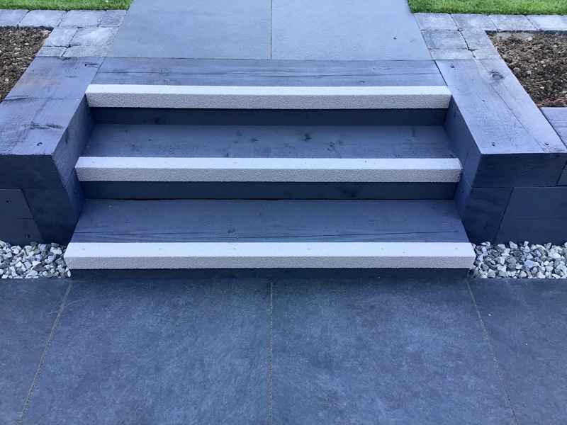 White anti slip stair nosing on timber steps