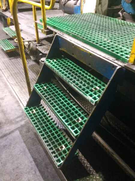 Green GRP Grating in workshop around lathes