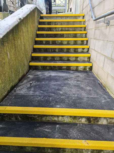 Black Yellow External stair tread covers and floor sheet used to cover damaged steps at Southern Water treatment plant