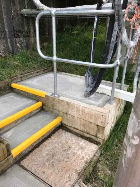 Yellow Anti Slip Stair Nosing on exterior concrete steps platform