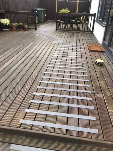 Dark Grey 50mm decking strips on slippery garden decking