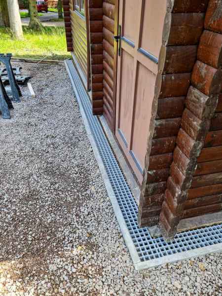 25mm grey grating used as drainage around log cabin