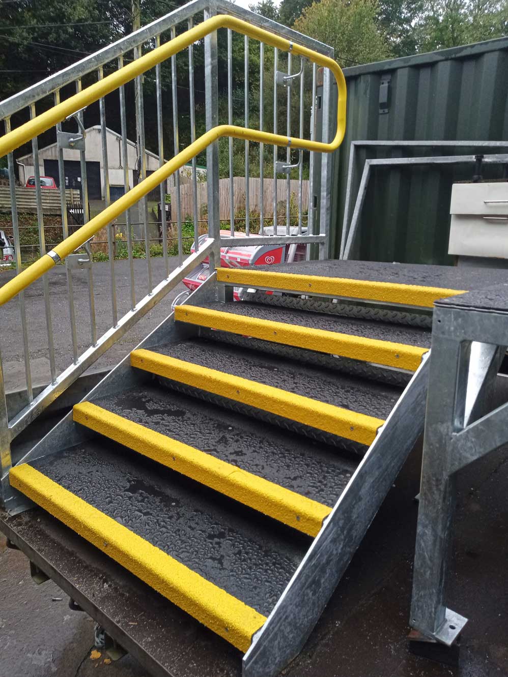 anti-slip stair treads used on an external metal staircase to prevent slips when wet