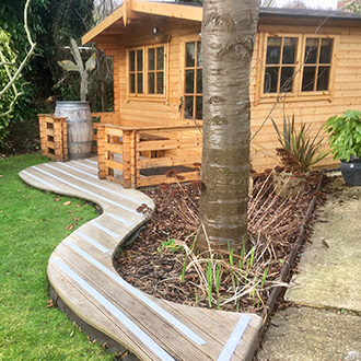 Garden Summer House decking strips installation.