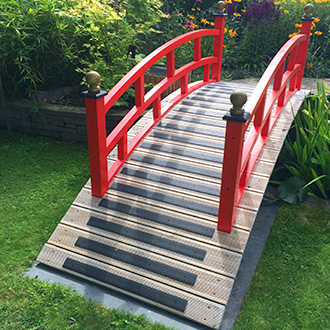 Garden landscape bridge installation.