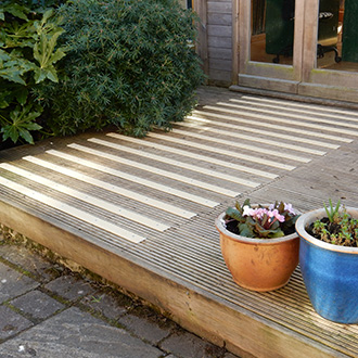 Buff non-slip strips added to slippery timber platforms.