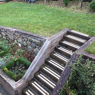 Garden areas with steep timber sleeper step areas.
