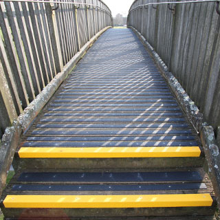Decking strips fitted to the timber footbridge path.