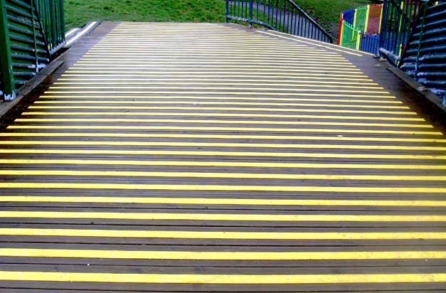 Recreation grounds, playgrounds and play areas with high visibility decking strips.