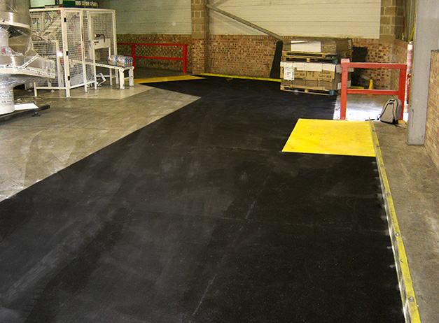 Heavy use factory loading bay area with floor sheet anti-slip areas.