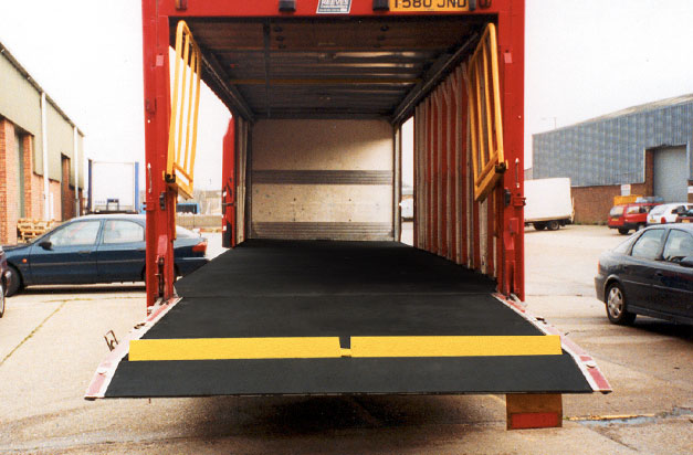 Anti-flip Floor covers applied to vehicle interior floor and ramp areas.