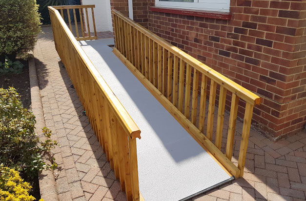 grey anti-slip floor sheets used on wooden decking access ramp for enhanced grip
