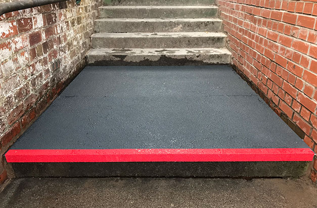 Floor sheets cut-to-size and installed to large step landing areas, with stair nosing edging.