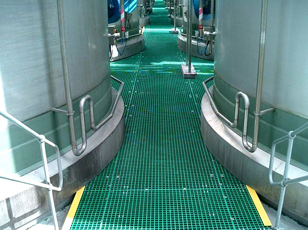 Chemical resistant and slip resistant GRP Grating installation for a brewery and distillery floors. The floors must withstand impact from kegs and barrels, trolleys and forklifts.