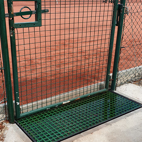 “GRP grid was cut-to-size to fit a plastic tray and then filled with water. Used as water batch to remove sand from players shoes after exiting tennis clay courts.“ H Thuillier.
