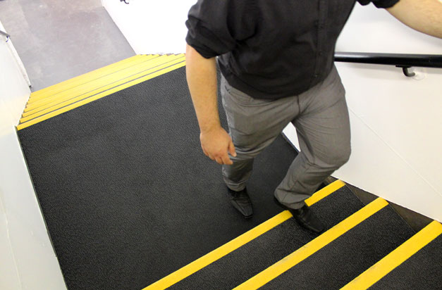 Anti-slip and high-vis stair treads and landing covers installation.