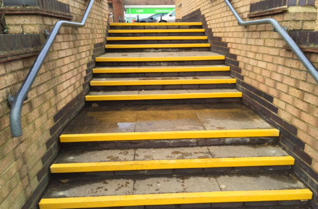 After - superstore paving steps with high visibility yellow stair nosings.