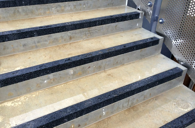 Concrete steps installation complete with flush-fitting anti-slip stair nosing.