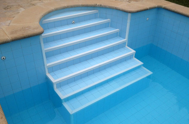 On this swimming pool the old ceramic tile nosing was starting to deglaze. The application of anti slip stair nosings made an easy and relatively quick way to put this right. Not having to remove old tiles and risk damage to tiles or substrate was a benefit, as well as the improved slip resistance on the steps. 