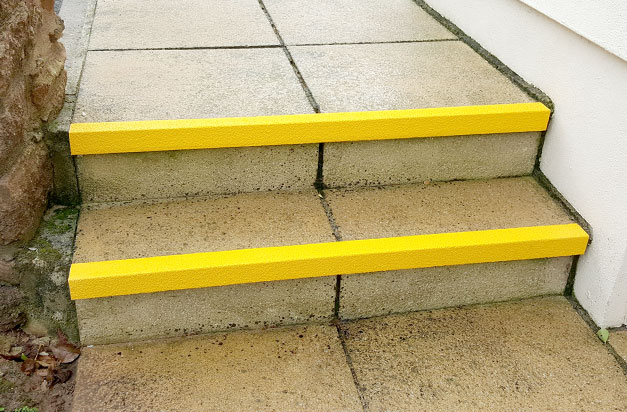 Slippery paving steps with anti-slip stair nosing.