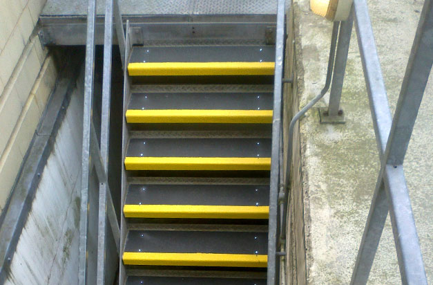 Anti-slip stair treads cover slippery steel stairs.