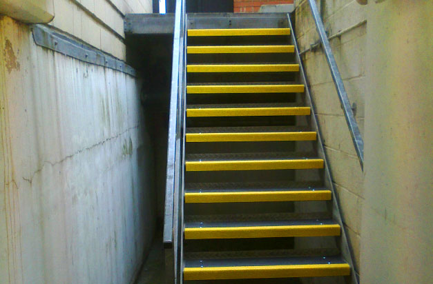 Industrial steel staircase with anti-slip stair treads.