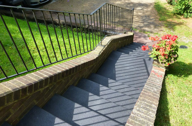 Garden stairs with one-colour black anti slip stair treads.