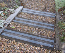 Non-slip decking strips on slippery wooden sleepers.