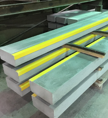 Anti-slip nosing on concrete steps.