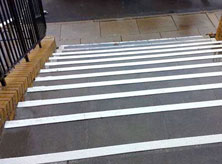 White stair nosings for high footfall concrete steps.