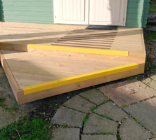 Summer house decking with anti slip nosing.